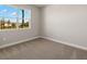 Bedroom with neutral carpet and a large window at 12193 Meditation Trl, Venice, FL 34293