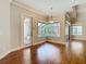 A dining room view featuring a window view of the screened pool at 2664 Keystone Springs Rd, Tarpon Springs, FL 34688