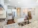 A view of the kitchen which features granite countertops, stainless steel appliances and a large island at 2664 Keystone Springs Rd, Tarpon Springs, FL 34688