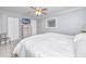 Bright bedroom features neutral decor, a dresser, and a cozy carpet at 6025 Shore S Blvd # 311, Gulfport, FL 33707