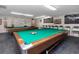 The billiard room features two tables, cues, and wall decor at 6025 Shore S Blvd # 311, Gulfport, FL 33707