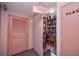 Charming book nook with floor-to-ceiling shelves, a library ladder, and a cozy reading space at 6025 Shore S Blvd # 311, Gulfport, FL 33707