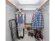 Organized walk-in closet with shelving, hanging rods and a built-in shoe rack for optimal storage at 6025 Shore S Blvd # 311, Gulfport, FL 33707