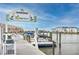 Community dock with boat slips and water access, offering stunning waterfront views and boating opportunities at 6025 Shore S Blvd # 311, Gulfport, FL 33707
