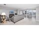 Open living room with tile floors, comfortable seating, and water views at 6025 Shore S Blvd # 311, Gulfport, FL 33707