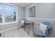 Small sitting area with a table and chairs overlooking the waterfront view at 6025 Shore S Blvd # 311, Gulfport, FL 33707