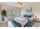 Bedroom with large window, neutral walls, and hardwood-style flooring at 6303 Green Oak Cir, Bradenton, FL 34203