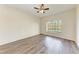 Large bedroom with wood-look floors and a large window at 6303 Green Oak Cir, Bradenton, FL 34203