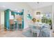 Inviting dining area with stylish seating, contemporary light fixture, and charming natural light at 6303 Green Oak Cir, Bradenton, FL 34203