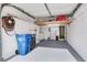 Spacious garage with shelving units, hanging storage, and laundry in back, and epoxy floor at 6303 Green Oak Cir, Bradenton, FL 34203