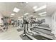 Bright community gym with treadmills, elliptical machines, and weightlifting equipment for resident use at 6303 Green Oak Cir, Bradenton, FL 34203