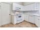 Well-lit kitchen with white appliances, and stylish countertops at 6303 Green Oak Cir, Bradenton, FL 34203