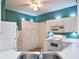 Bright kitchen featuring white appliances, ample counter space, and a clean, modern design at 6303 Green Oak Cir, Bradenton, FL 34203