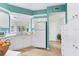 Bright kitchen with white cabinetry, modern appliances, and ample countertop space at 6303 Green Oak Cir, Bradenton, FL 34203