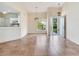 Open-concept living space with tile floors, stylish lighting, and easy access to the kitchen at 6303 Green Oak Cir, Bradenton, FL 34203
