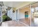 Enclosed patio featuring tile flooring and direct access to living area with bright, modern kitchen at 6303 Green Oak Cir, Bradenton, FL 34203