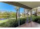 Relaxing screened patio with serene pond views, perfect for enjoying the outdoors in comfort at 6303 Green Oak Cir, Bradenton, FL 34203