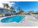 Inviting community pool with lounge chairs, umbrellas, and a gazebo, perfect for relaxing and socializing at 6303 Green Oak Cir, Bradenton, FL 34203