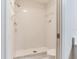 The bathroom features a standalone shower with white tile, as well as a toilet next to the shower at 6303 Green Oak Cir, Bradenton, FL 34203