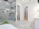 Spa-like bathroom with glass shower, freestanding tub, and modern vanity at 716 S Lois Ave, Tampa, FL 33609