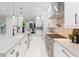 Bright kitchen showcasing a large island, stainless steel appliances, and a sleek, modern design at 716 S Lois Ave, Tampa, FL 33609