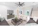Inviting living room with neutral decor, modern furnishings, and an open layout leading to other parts of the house at 716 S Lois Ave, Tampa, FL 33609