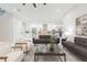 Spacious living room features a modern design, open to the kitchen, creating an ideal space for entertaining guests at 716 S Lois Ave, Tampa, FL 33609