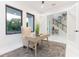 Bright home office and staircase view with neutral furniture, natural light, and a modern design at 716 S Lois Ave, Tampa, FL 33609