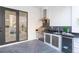 Outdoor kitchen area features a built-in grill, modern appliances, and seamless transition to the indoor space at 716 S Lois Ave, Tampa, FL 33609