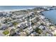 Bright aerial view of a coastal neighborhood with colorful homes close to the beach and the bay at 18077 3Rd St, Redington Shores, FL 33708