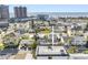 Bright aerial view of a coastal neighborhood and home close to the beach and the beautiful ocean at 18077 3Rd St, Redington Shores, FL 33708