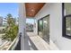 This cozy covered balcony features sliding glass doors and plenty of sunlight at 18077 3Rd St, Redington Shores, FL 33708
