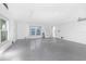 Spacious and bright garage features an epoxy floor, windows, and ample room for vehicles at 18077 3Rd St, Redington Shores, FL 33708
