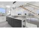 Modern kitchen featuring a large island, white cabinetry, and stainless steel appliances at 18077 3Rd St, Redington Shores, FL 33708