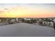 Sunset views from a rooftop deck with a black railing at 18077 3Rd St, Redington Shores, FL 33708
