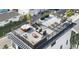 Inviting rooftop patio with lounge seating, a hot tub, a fire pit and views of the neighborhood at 18077 3Rd St, Redington Shores, FL 33708