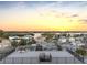 Rooftop sunset view overlooking the neighborhood, a bayou, and colorful sky at 18077 3Rd St, Redington Shores, FL 33708