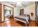 Bedroom with mirror closet doors and hardwood floors at 5927 3Rd N Ave, St Petersburg, FL 33710