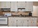 Traditional kitchen with vintage appliances and white cabinetry at 5927 3Rd N Ave, St Petersburg, FL 33710
