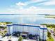 Aerial view of condominium building overlooking a beautiful bay at 7 Elgin Pl # 603, Dunedin, FL 34698