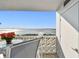 Cozy balcony features a dining set and a view of the bay at 7 Elgin Pl # 603, Dunedin, FL 34698