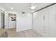 Light filled bedroom featuring a built-in storage cabinet with drawers and wood look floors at 7 Elgin Pl # 603, Dunedin, FL 34698