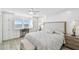 Light and bright bedroom with an upholstered headboard, custom built-ins and water views at 7 Elgin Pl # 603, Dunedin, FL 34698