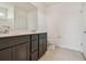 Bathroom with double sink vanity, granite countertop, and ample storage space at 12815 Wanderlust Pl, Parrish, FL 34219
