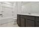 Bathroom with a vanity, a large mirror, and a shower-tub combination at 12815 Wanderlust Pl, Parrish, FL 34219