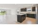Open concept kitchen and living area, offering a spacious and modern design at 12815 Wanderlust Pl, Parrish, FL 34219