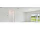 Bright living room with sliding glass doors and view of water at 12815 Wanderlust Pl, Parrish, FL 34219