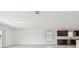 Open-concept living room with modern finishes, plenty of natural light, and seamless access to the kitchen at 12815 Wanderlust Pl, Parrish, FL 34219