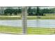Window view of a serene lake, showcasing the natural beauty of the property at 12815 Wanderlust Pl, Parrish, FL 34219