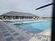 Community pool with lounge chairs providing a luxurious and relaxing outdoor experience for residents at 2402 Cumberland Cliff Dr, Ruskin, FL 33570